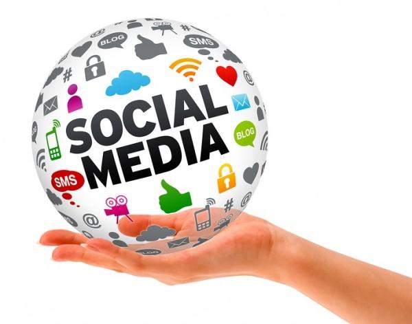 Social media globe in hand